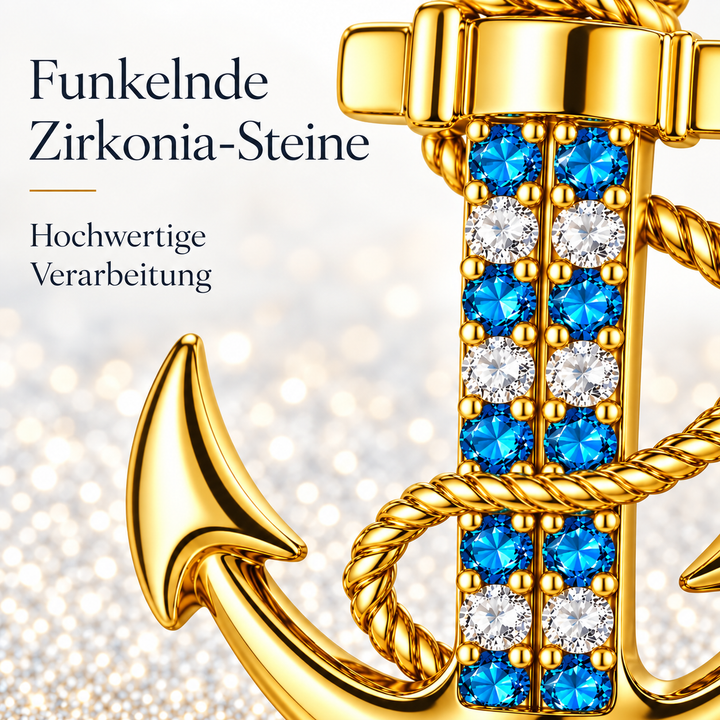 Detail der goldenen PAVELS Ankerkette mit funkelnden blauen und weißen Zirkonia-Steinen und hochwertiger Verarbeitung