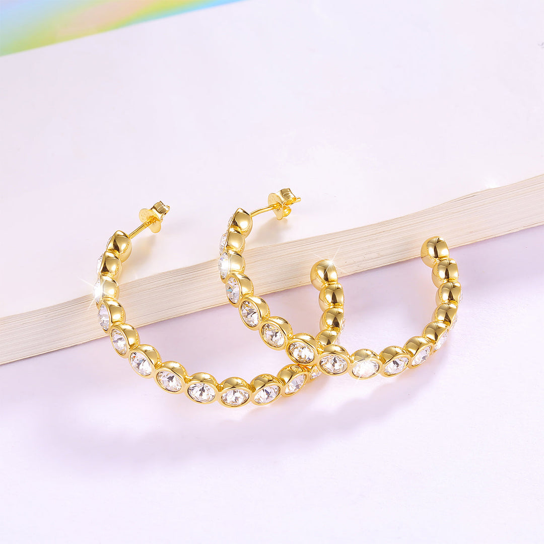 Funkelnde Damen-Creolen aus 925 Sterlingsilber – mit edlen Zirkonia besetzt, eleganter Silberschmuck für Alltag und Abendmode.